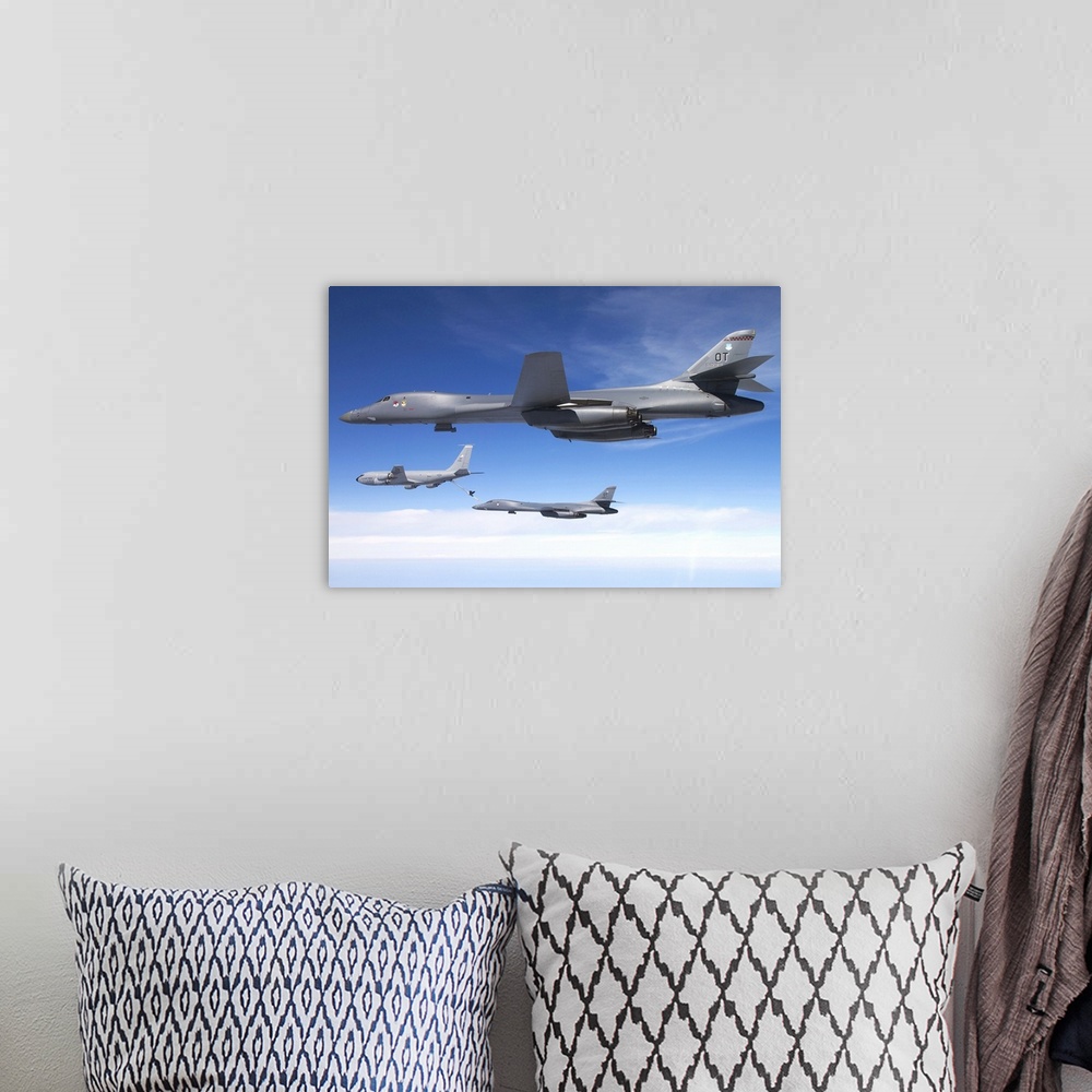A bohemian room featuring A B-1B Lancer stands by as another Lancer connects with a KC-135 Stratotanker.