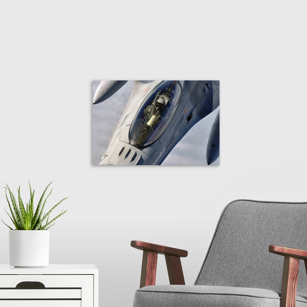 A modern room featuring A Belgian F-16 Fighting Falcon.