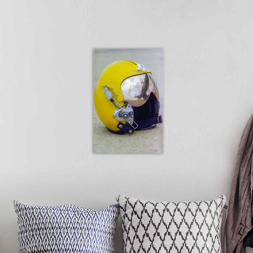 A bohemian room featuring A Blue Angels pilot helmet with aircraft reflection in visor.