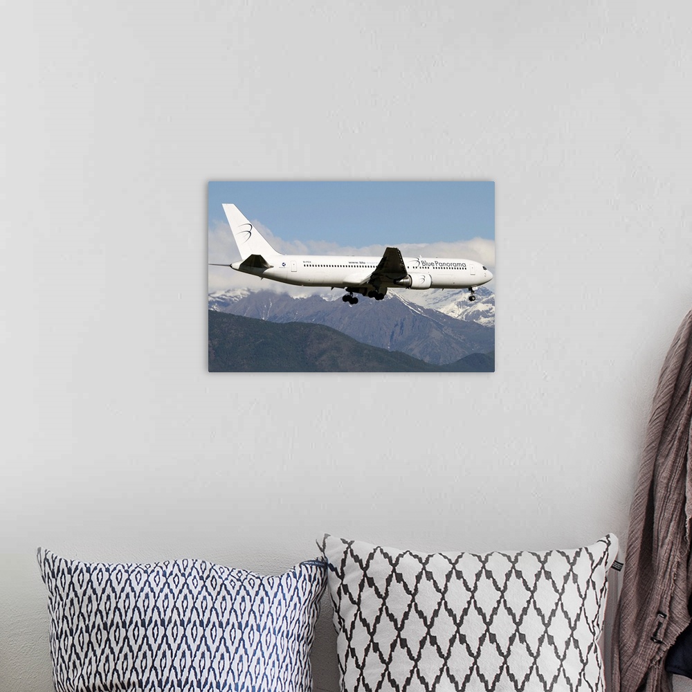 A bohemian room featuring A Boeing 767 of Blue Panorama Airlines flying over Italy.