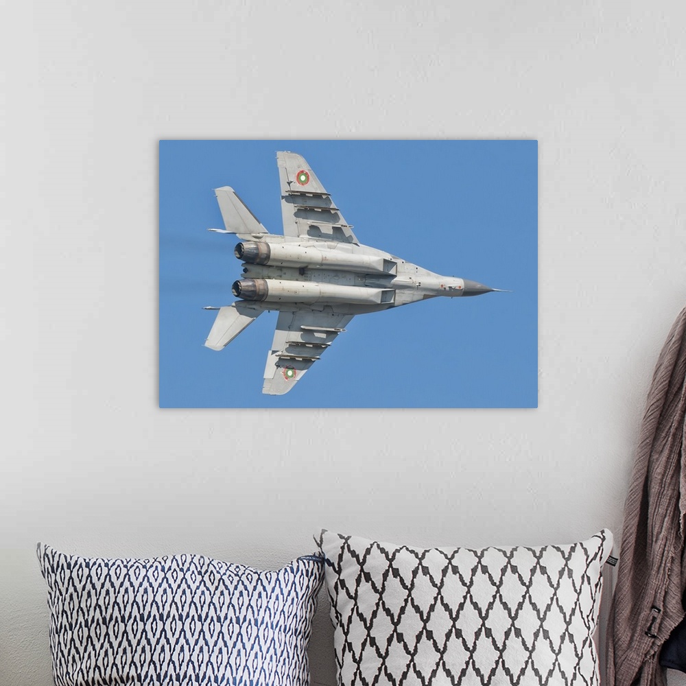 A bohemian room featuring A Bulgarian Air Force MiG-29 in flight over Bulgaria.