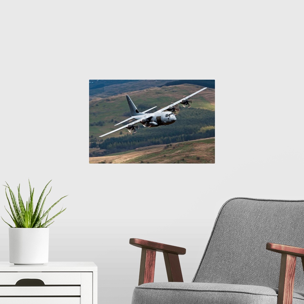 A modern room featuring A C-130 Hercules of the Royal Air Force flying over North Wales, United Kingdom.