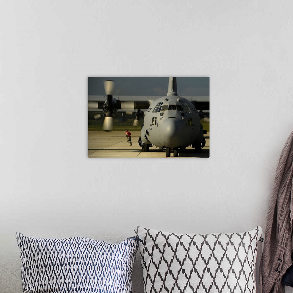 A bohemian room featuring A C-130H Hercules on the flight line at Lielvarde Air Base, Latvia.