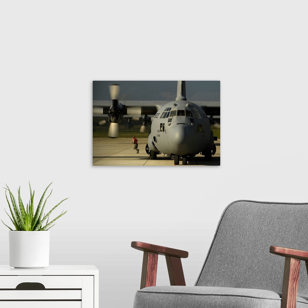 A modern room featuring A C-130H Hercules on the flight line at Lielvarde Air Base, Latvia.