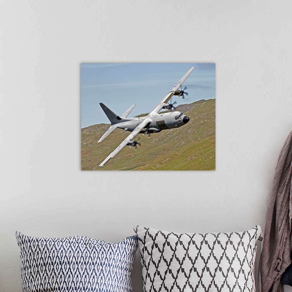 A bohemian room featuring A C-130J Super Hercules low flying over North Wales on a training flight. The C-130J is a compreh...