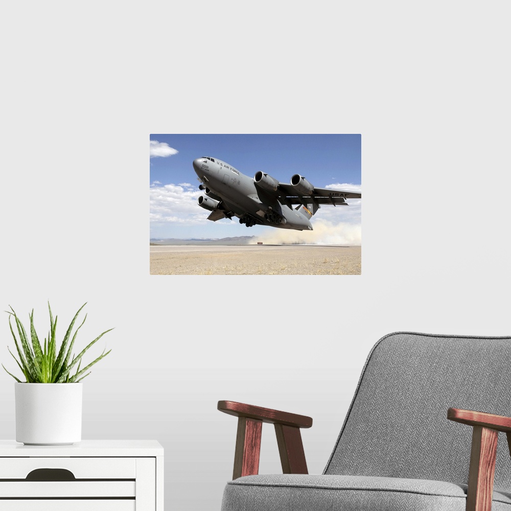 A modern room featuring A C-17 Globemaster departs from the Tonopah runway.
