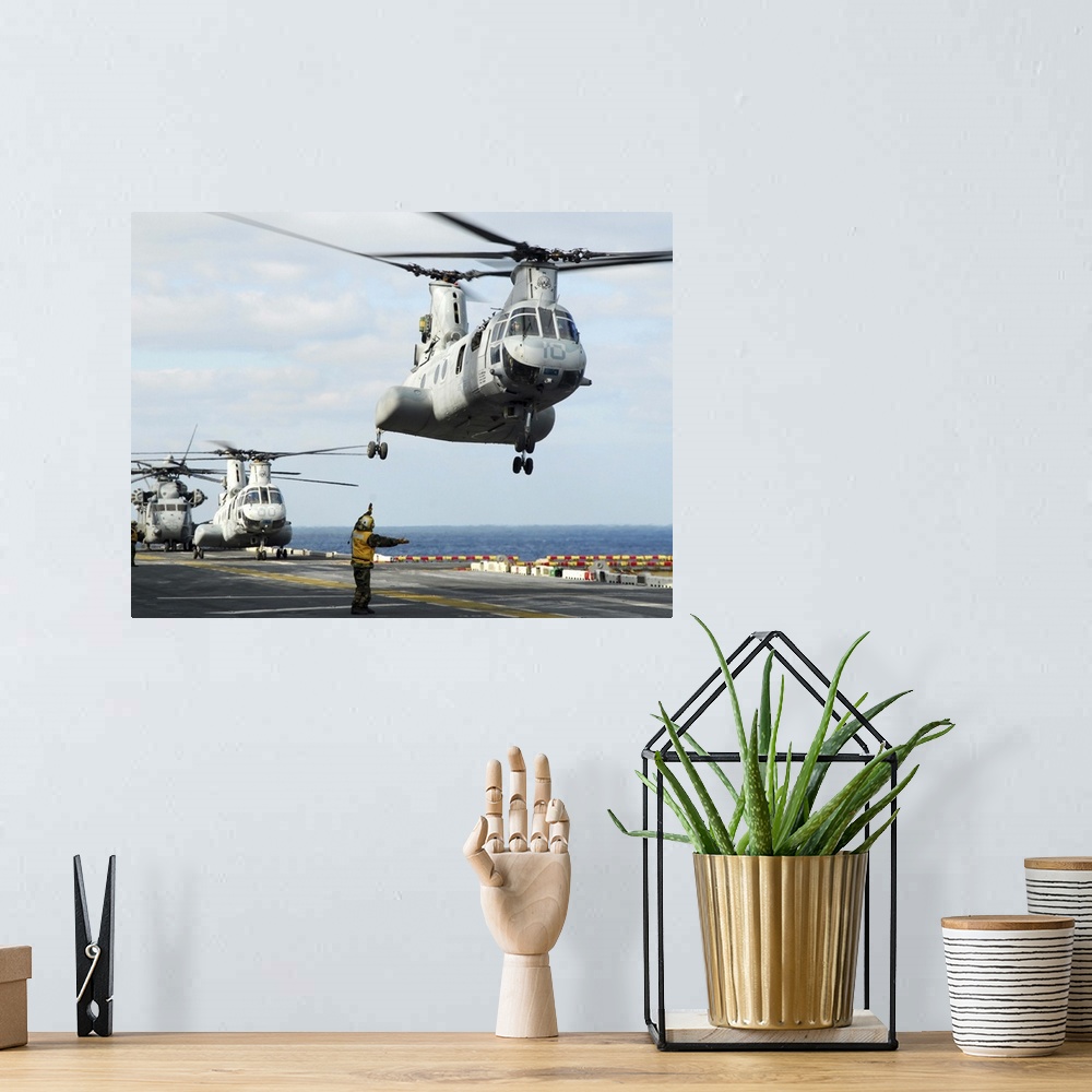 A bohemian room featuring Sea of Japan, March 18, 2011 - A CH-46E Sea Knight helicopter takes off from the flight deck of t...