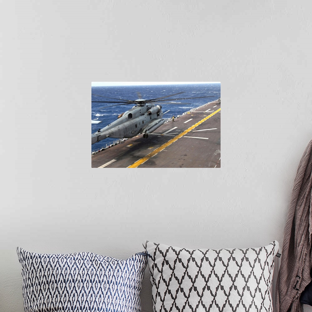 A bohemian room featuring A CH-53 Super Stallion helicopter aboard USS Bataan.