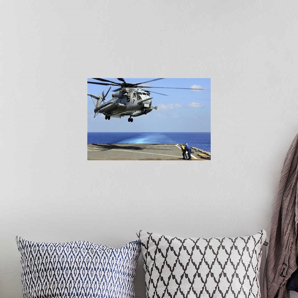 A bohemian room featuring Indian Ocean, March 26, 2011 - A CH-53E Super Stallion helicopter lifts off from the amphibious d...