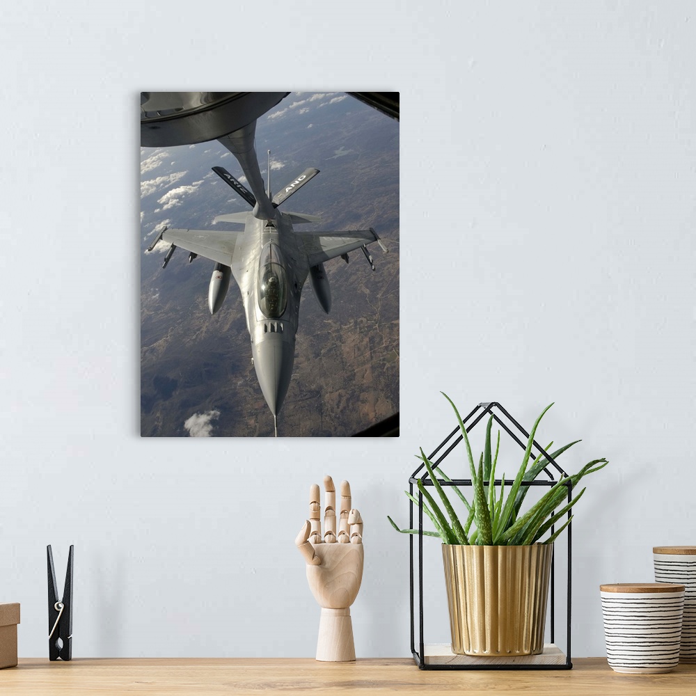 A bohemian room featuring A Chilean Air Force F-16 Fighting Falcon refuels from a U.S. Air Force KC-135 Stratotanker over B...