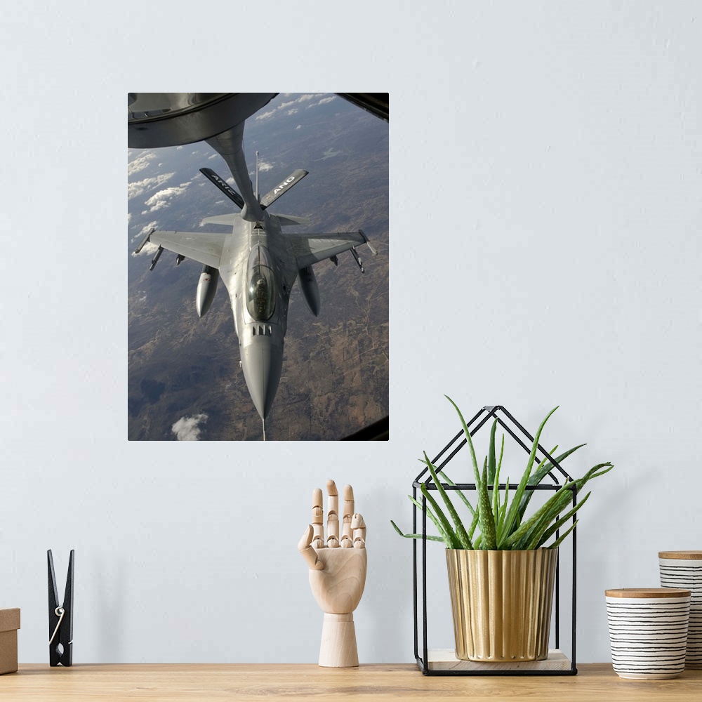 A bohemian room featuring A Chilean Air Force F-16 Fighting Falcon refuels from a U.S. Air Force KC-135 Stratotanker over B...