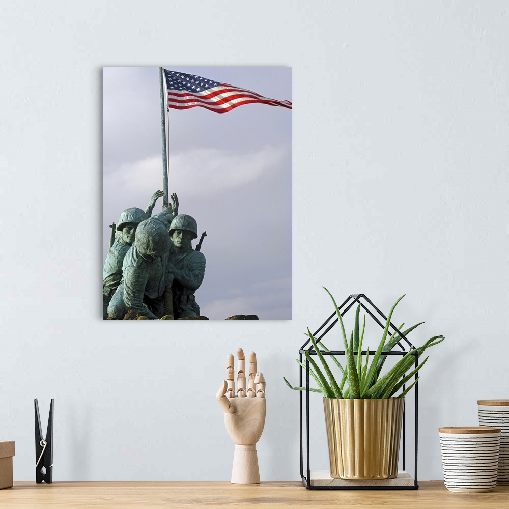 A bohemian room featuring Up-close photograph of monument of soldiers lifting the American flag.