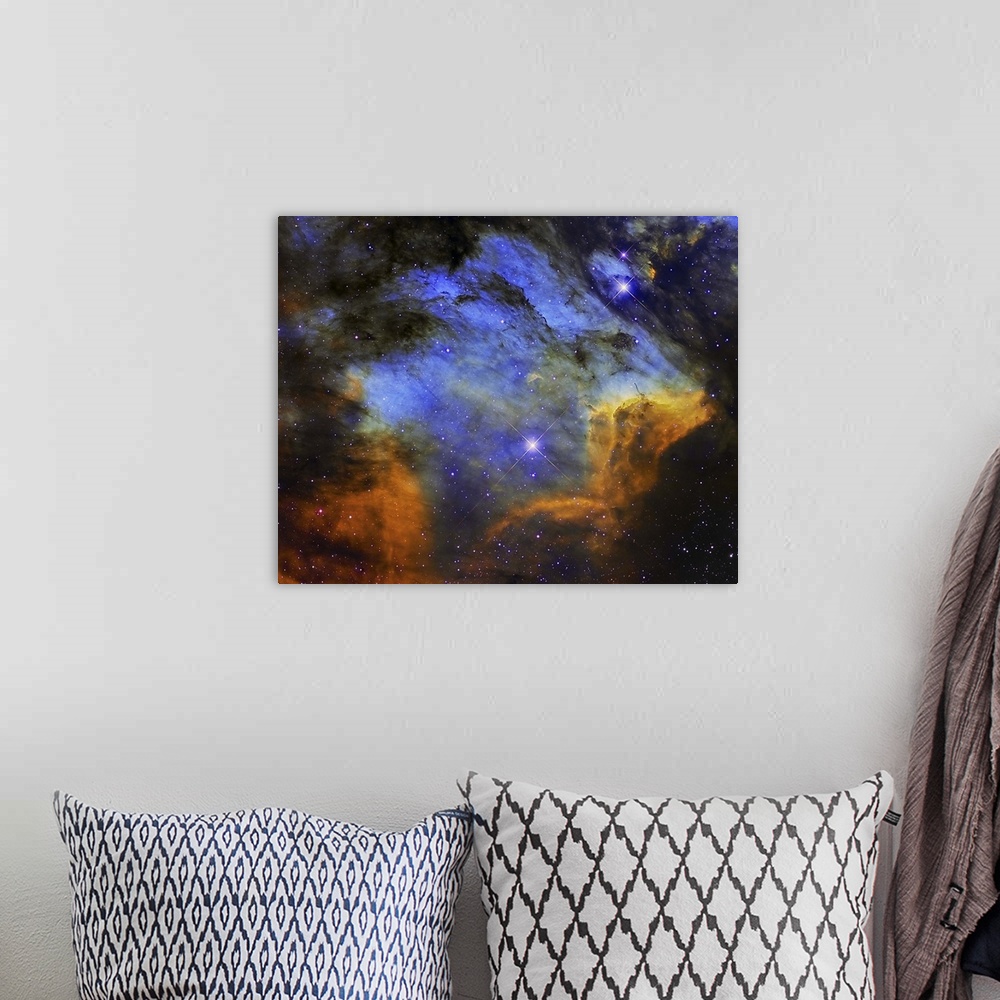 A bohemian room featuring A colorful Pelican Nebula in the constellation Cygnus.