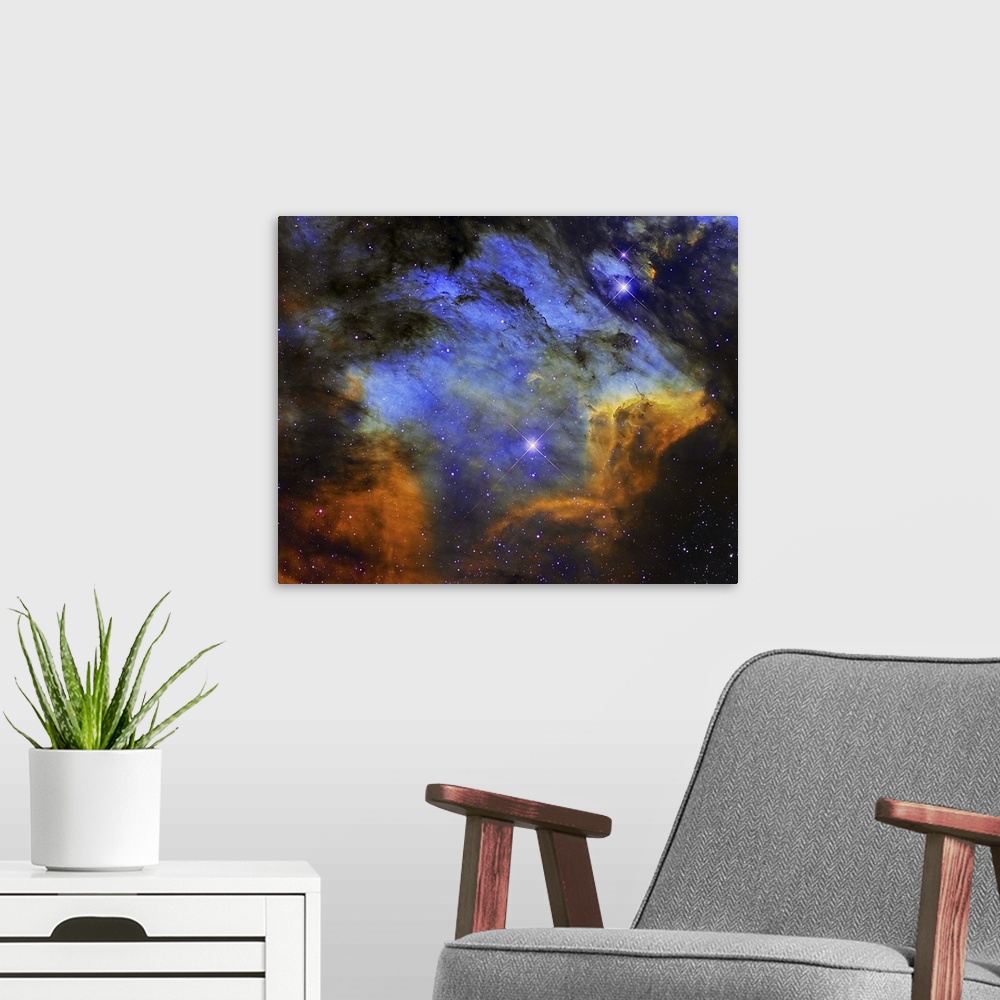 A modern room featuring A colorful Pelican Nebula in the constellation Cygnus.