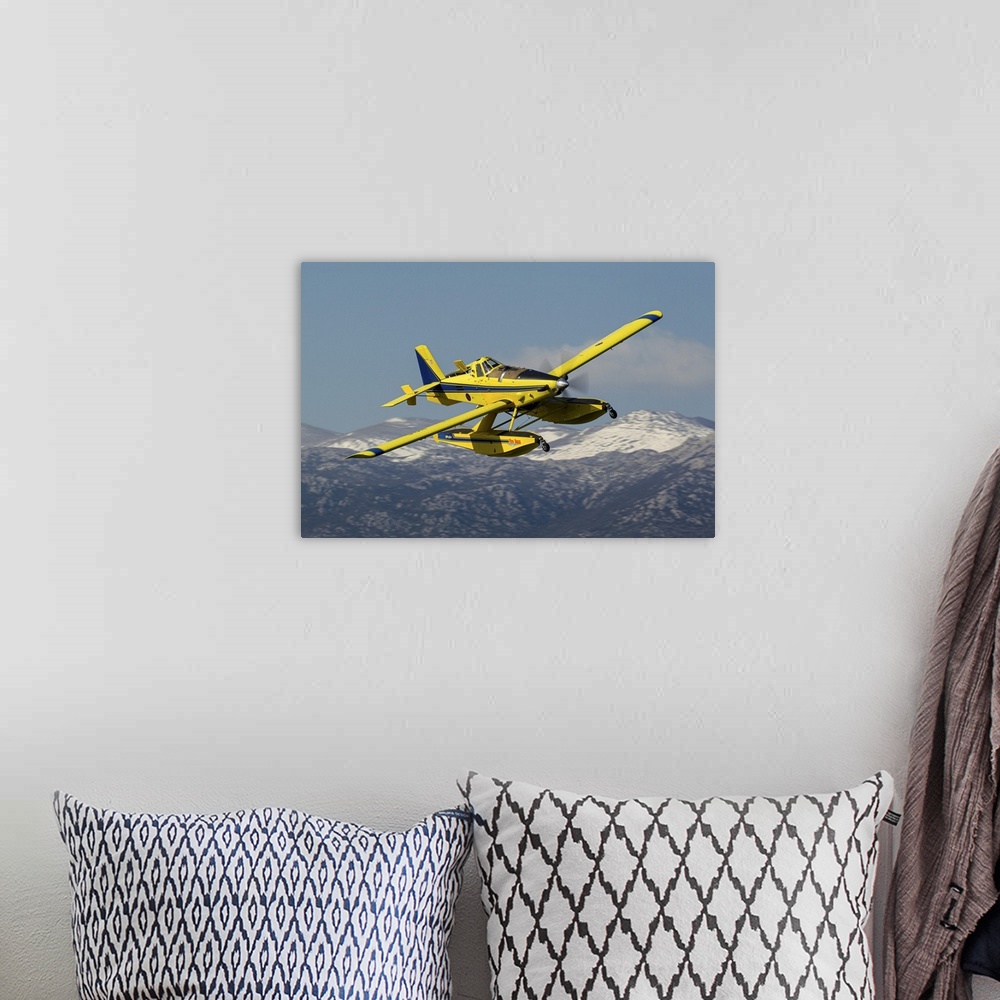 A bohemian room featuring A Croatian Air Force AT-802 firefighting aircraft in flight during a training flight near its hom...