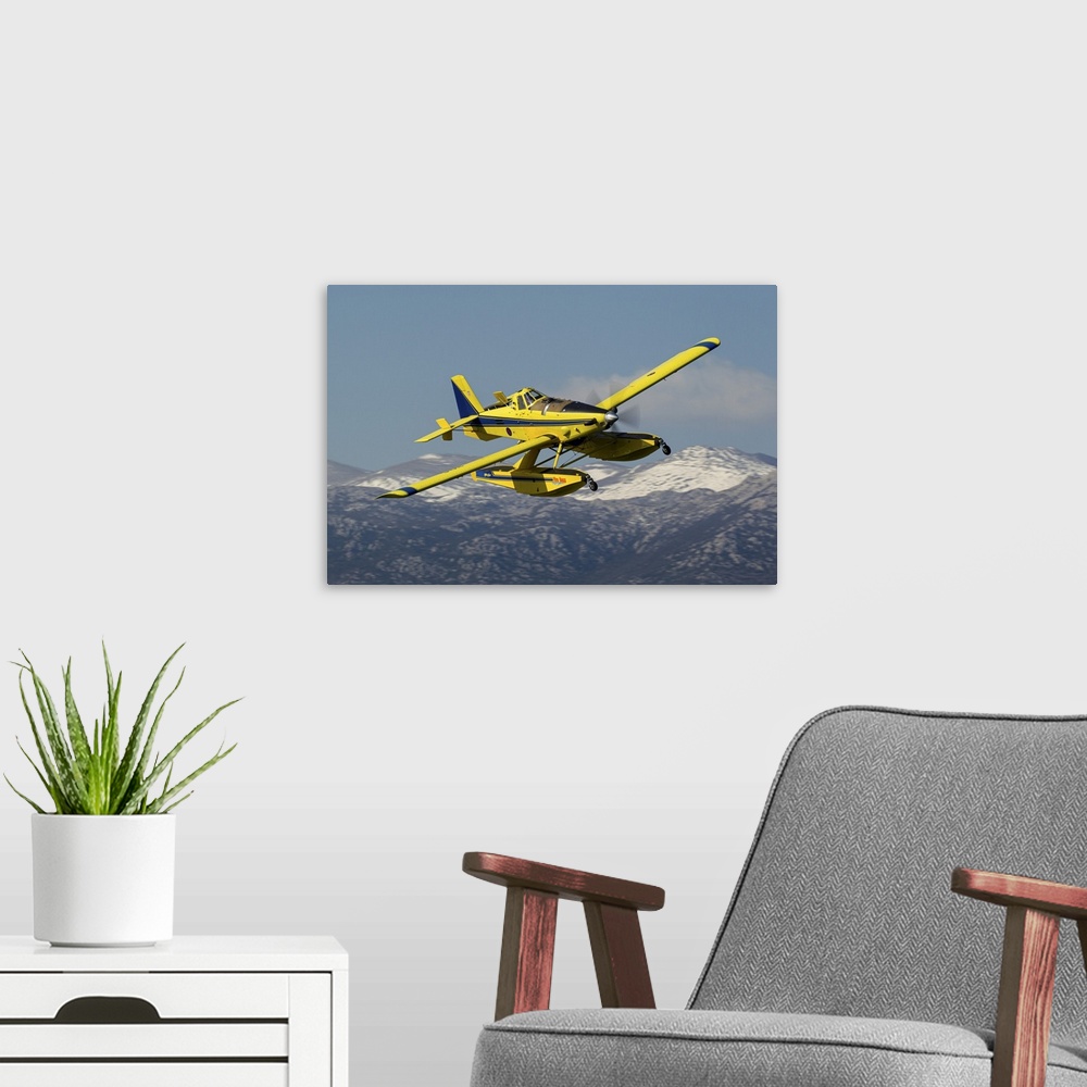 A modern room featuring A Croatian Air Force AT-802 firefighting aircraft in flight during a training flight near its hom...