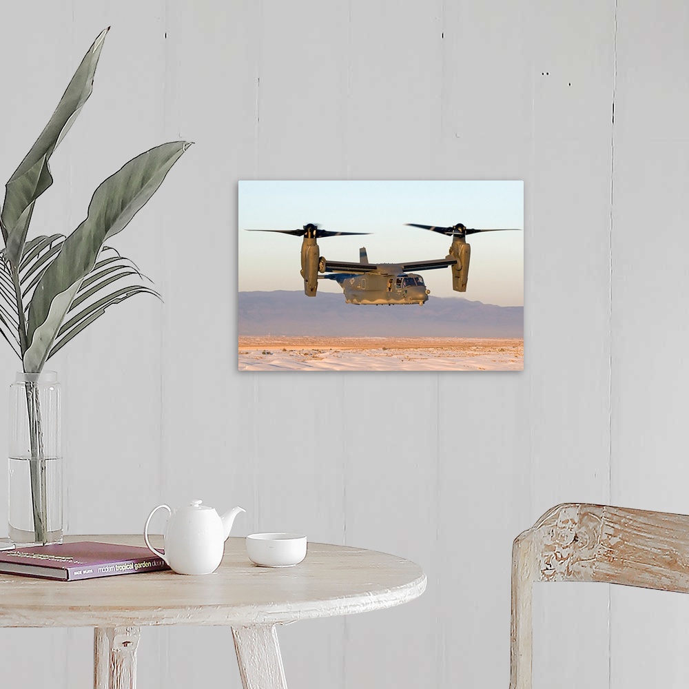 A farmhouse room featuring A CV-22 Osprey from the 71st Special Operations Squadron flies in helicopter mode during a traini...