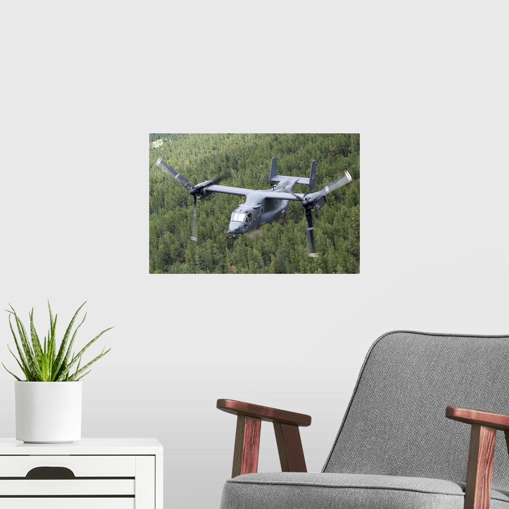 A modern room featuring A CV-22 Osprey from the 71st Special Operations Squadron manuevers during a training mission out ...