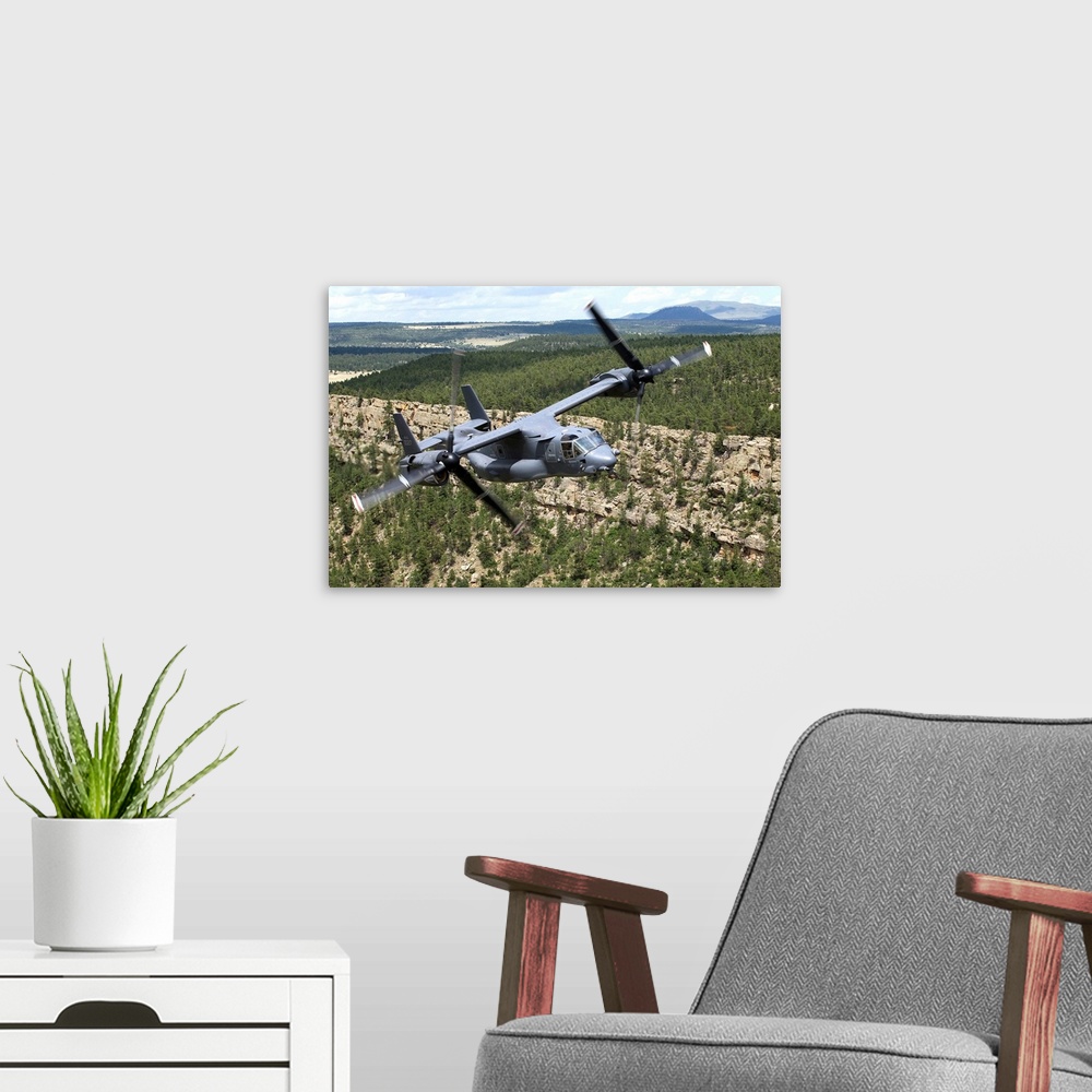 A modern room featuring A CV-22 Osprey from the 71st Special Operations Squadron manuevers during a training mission out ...