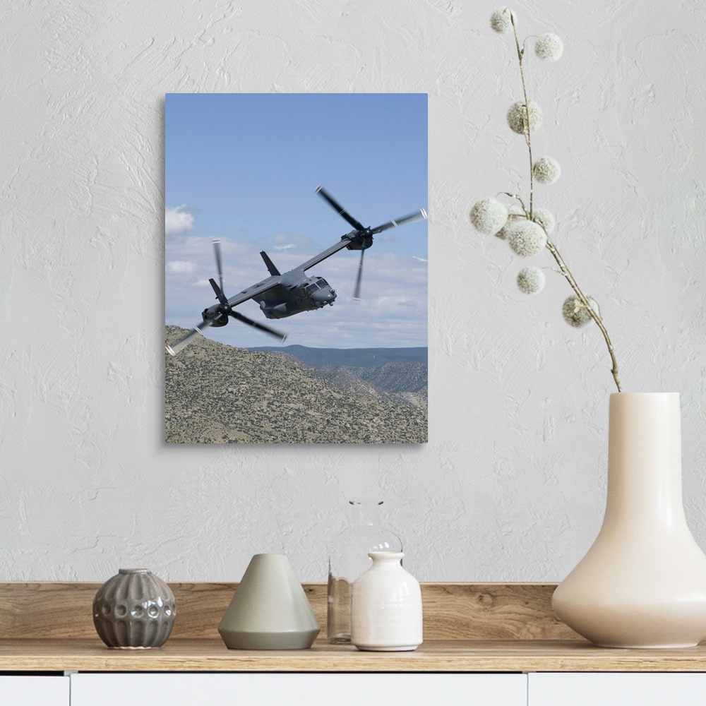 A farmhouse room featuring A CV-22 Osprey from the 71st Special Operations Squadron manuevers during a training mission out ...