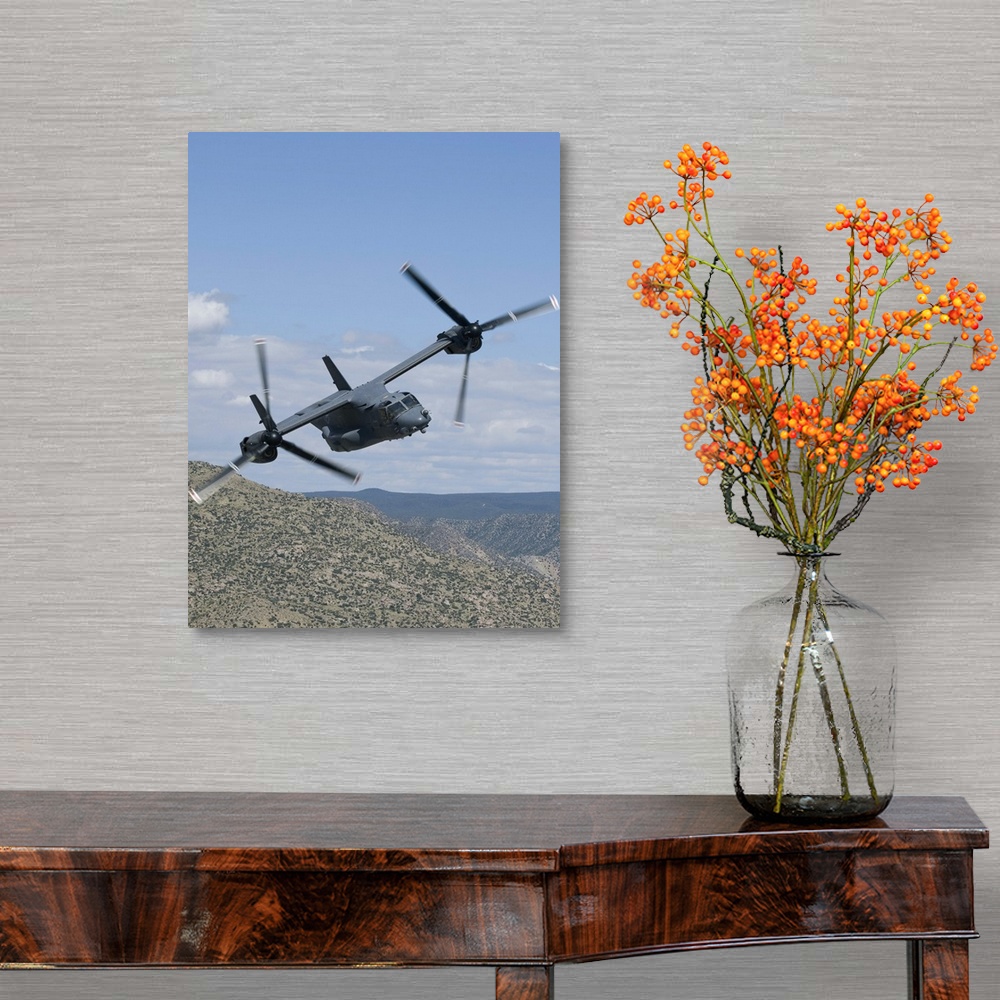 A traditional room featuring A CV-22 Osprey from the 71st Special Operations Squadron manuevers during a training mission out ...