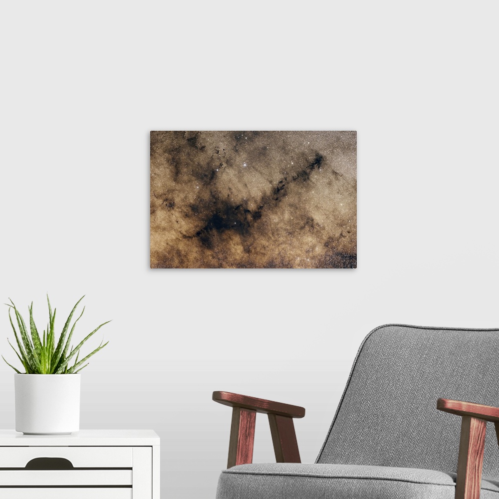 A modern room featuring A dark nebula against the Milky Way.