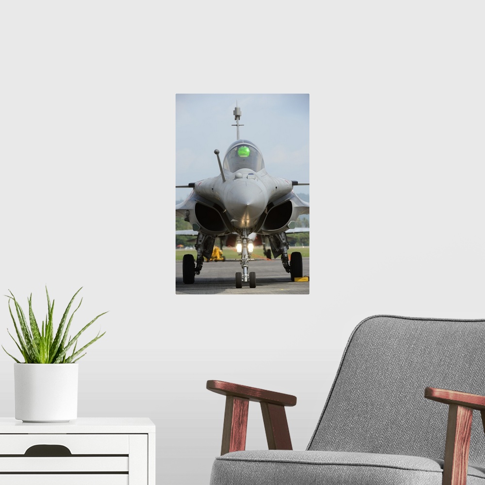 A modern room featuring A Dassault Rafale fighter aircraft of the French Air Force.