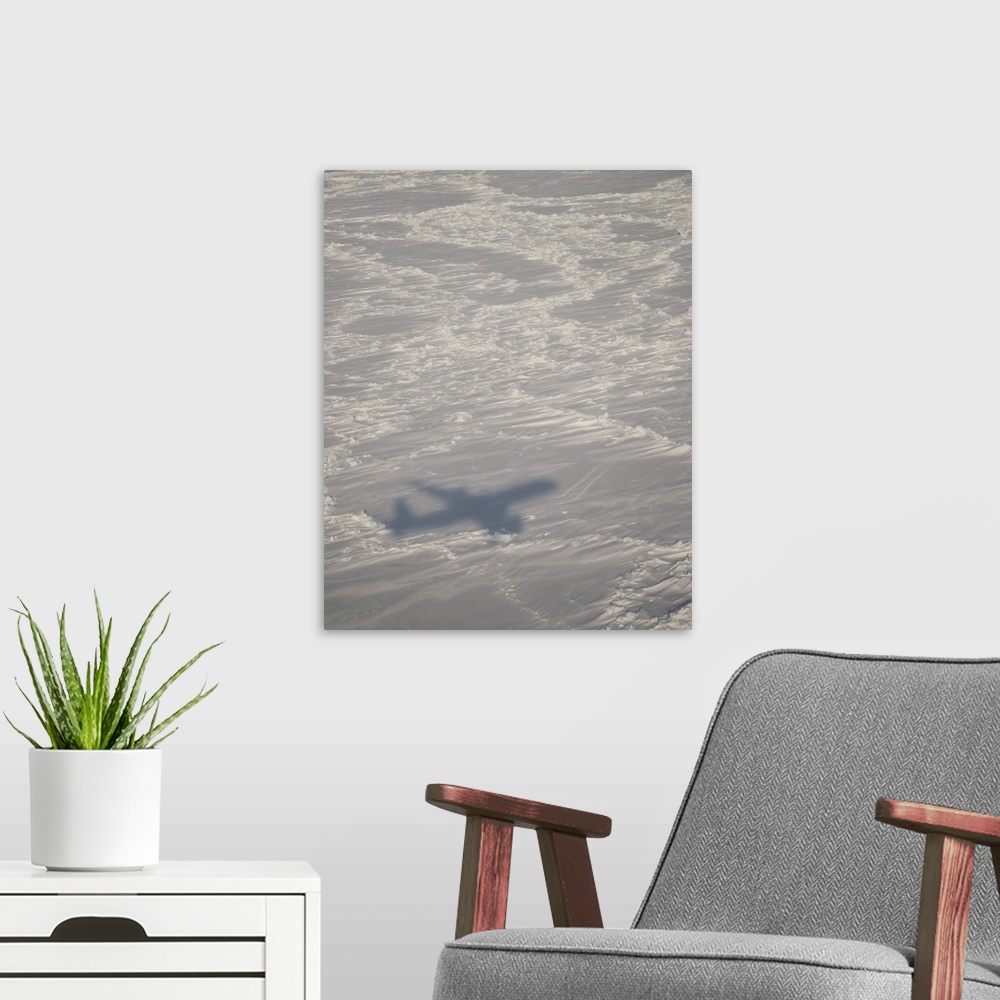 A modern room featuring A DC-8 aircraft casts its shadow over the Bering Sea.