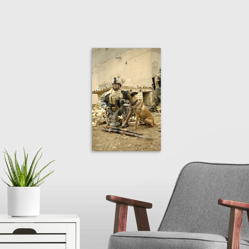 A modern room featuring A dog handler and his military working dog take a short break.
