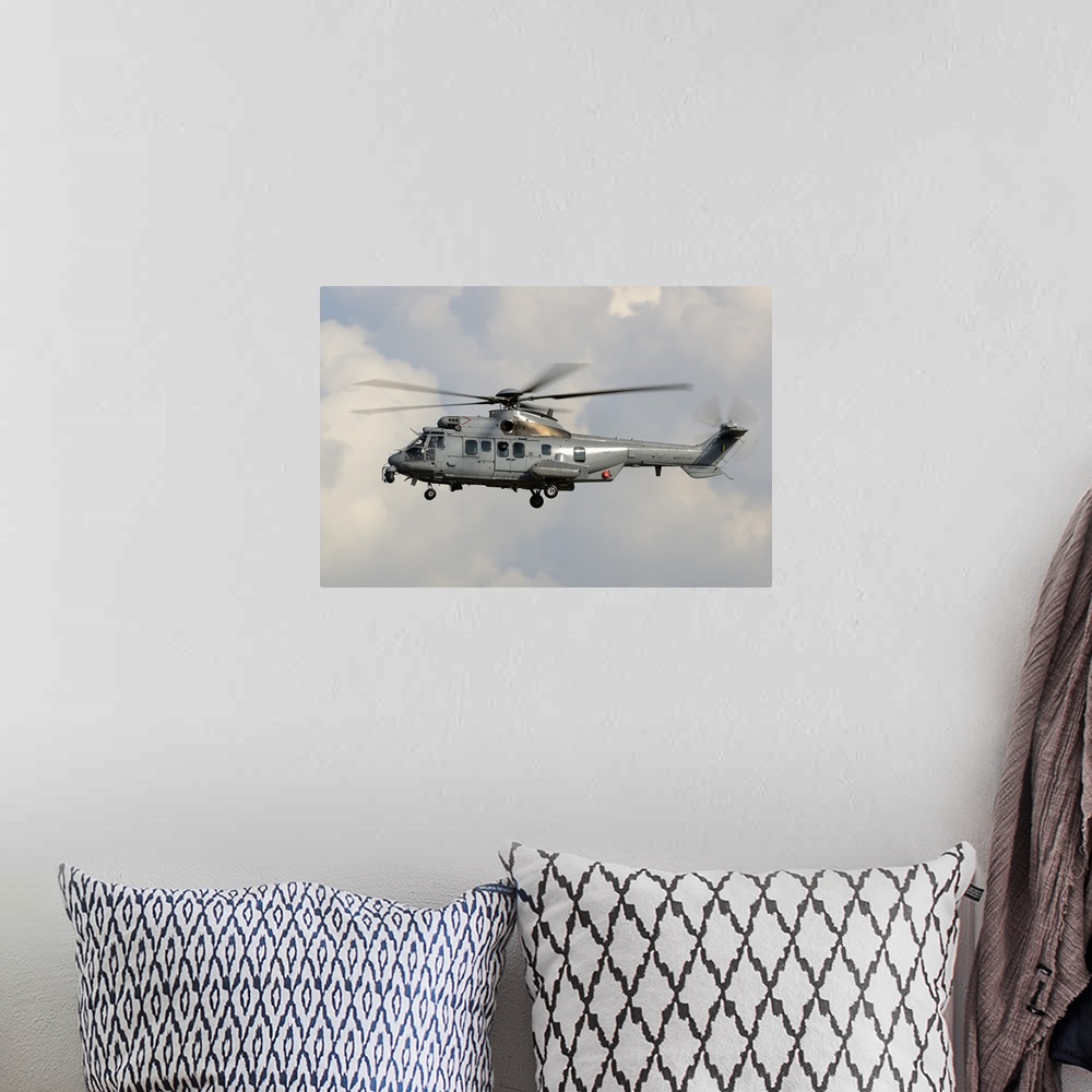 A bohemian room featuring A Eurocopter AS532 Cougar of the Royal Malaysian Air Force.