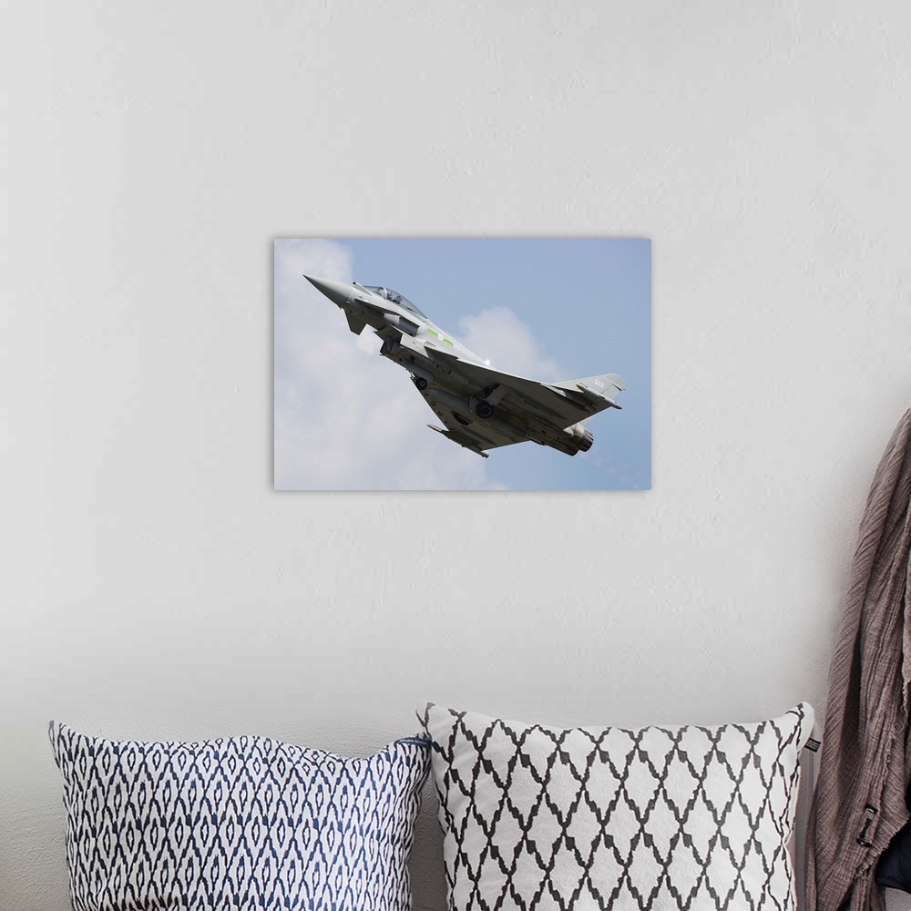 A bohemian room featuring March 29, 2013 - A Eurofighter Typhoon of the Royal Air Force in flight over Langkawi Airport, Ma...