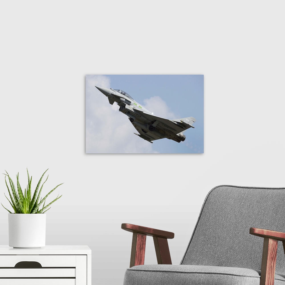 A modern room featuring March 29, 2013 - A Eurofighter Typhoon of the Royal Air Force in flight over Langkawi Airport, Ma...