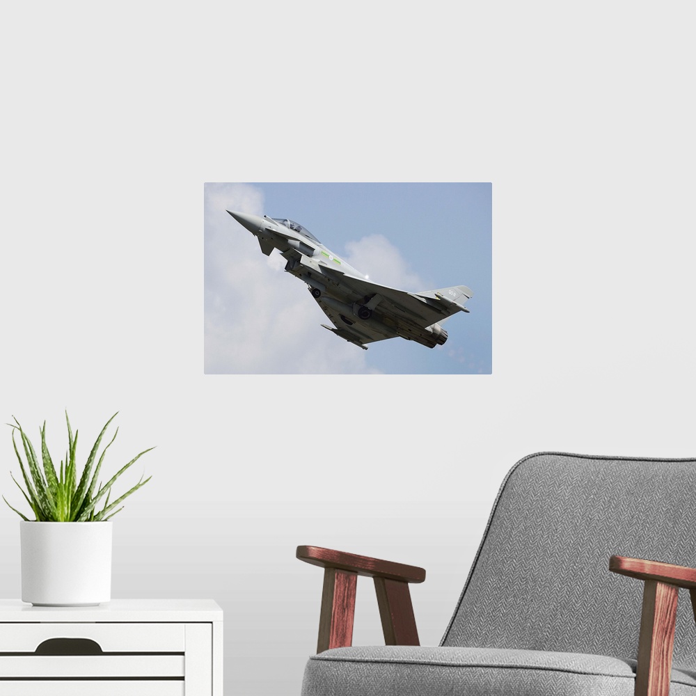 A modern room featuring March 29, 2013 - A Eurofighter Typhoon of the Royal Air Force in flight over Langkawi Airport, Ma...