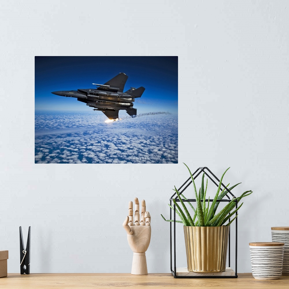 A bohemian room featuring December 17, 2010 - A U.S. Air Force F-15E Strike Eagle aircraft releases flares during a local t...