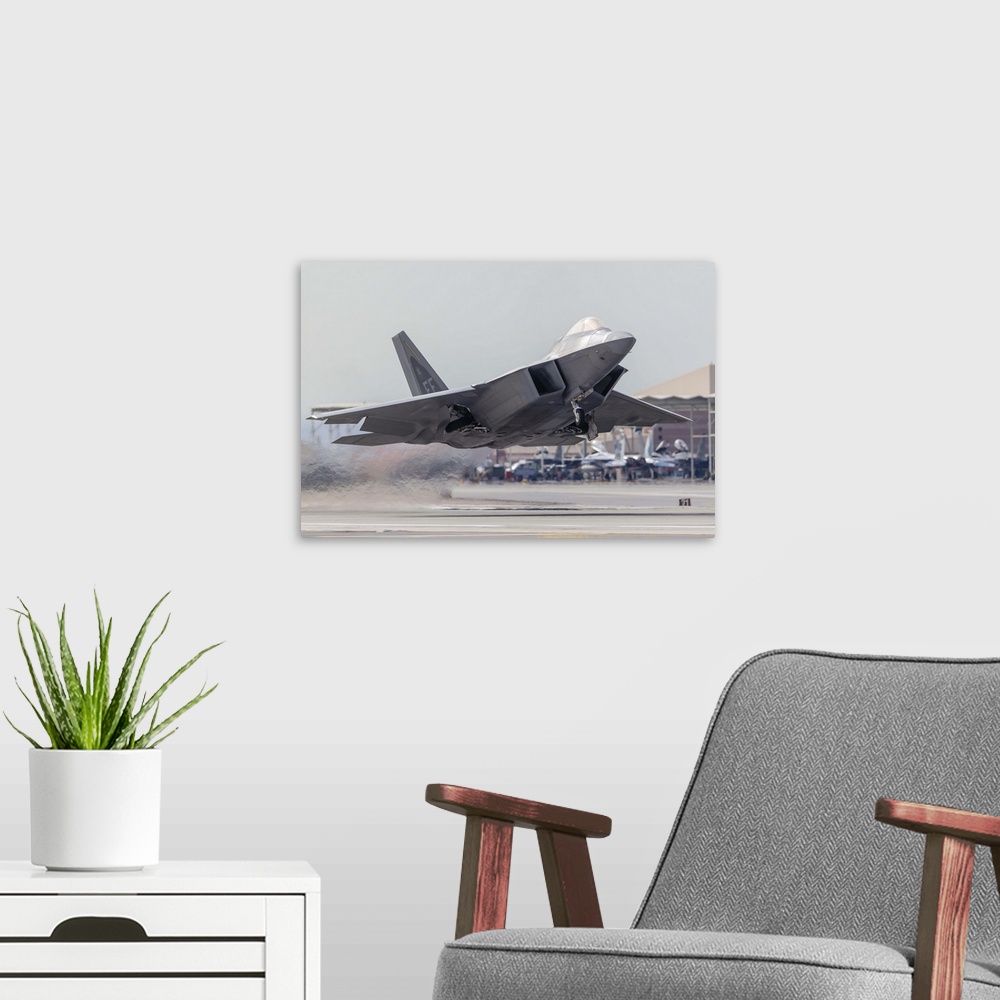 A modern room featuring A F-22 Raptor of the U.S. Air Force launches from Nellis Air Force Base, Nevada.