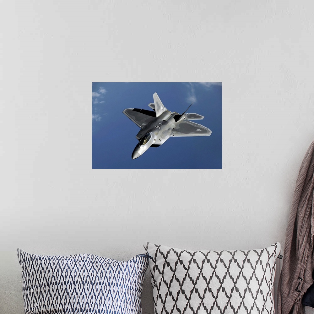 A bohemian room featuring A F-22 Raptor returns to a mission after refueling.