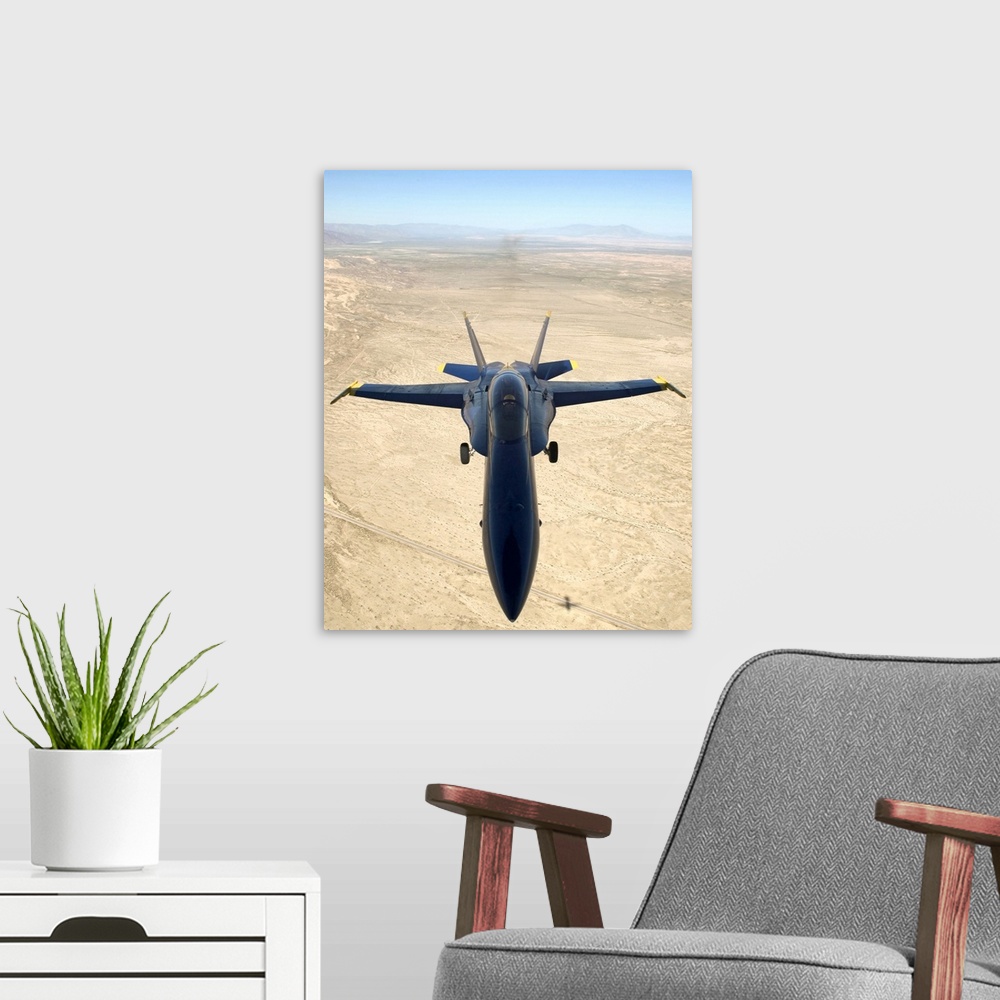 A modern room featuring A F/A18A Hornet flys over the desert landscape of Imperial Valley