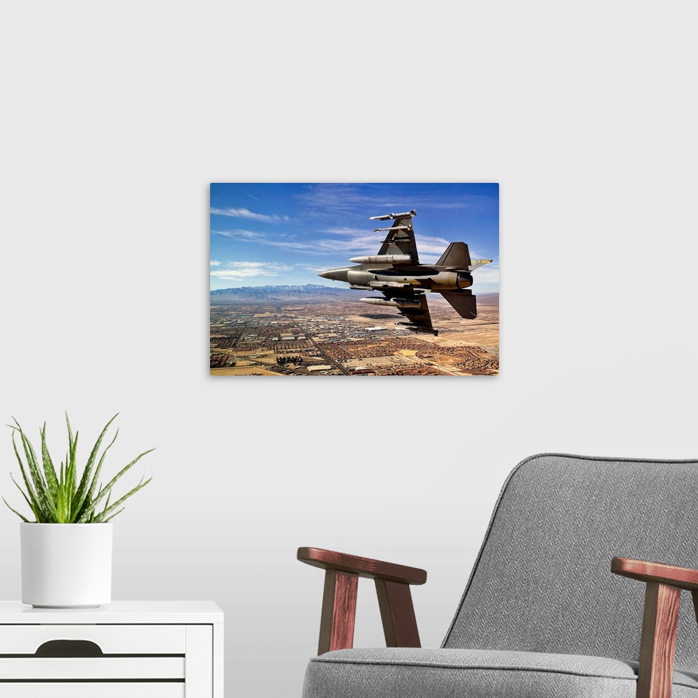 A modern room featuring A fighter jet breaks right on a final approach over northern Las Vegas during day three of Red Fl...
