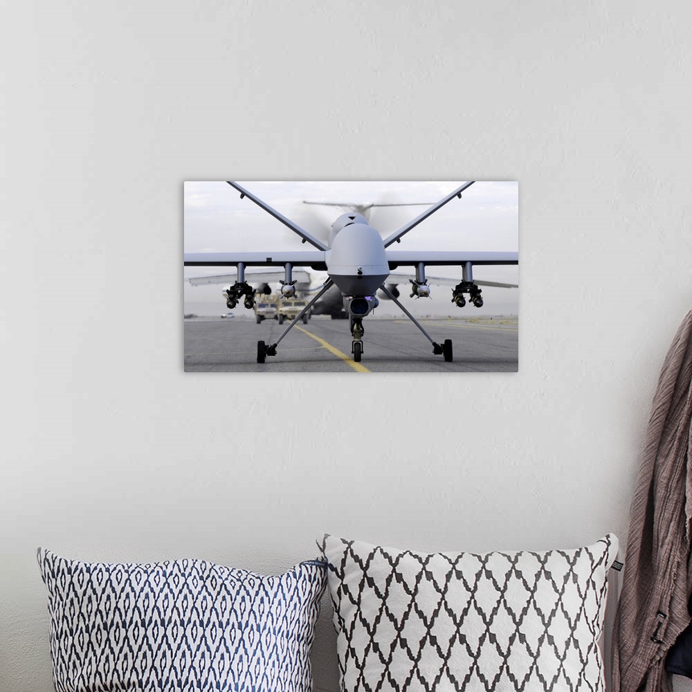 A bohemian room featuring November 4, 2007 - A fully armed MQ-9 Reaper taxis down an Afghanistan runway.