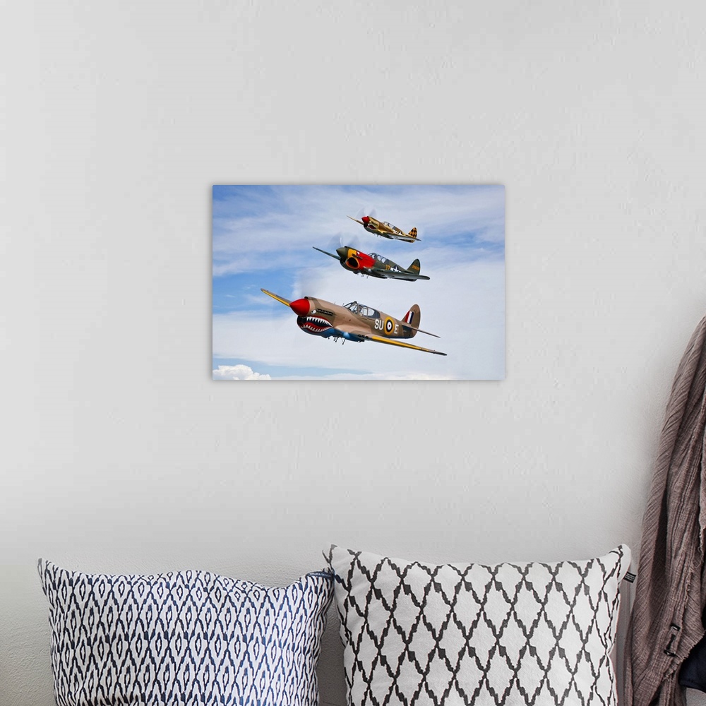 A bohemian room featuring A group of P-40 Warhawks fly in formation near Nampa, Idaho.
