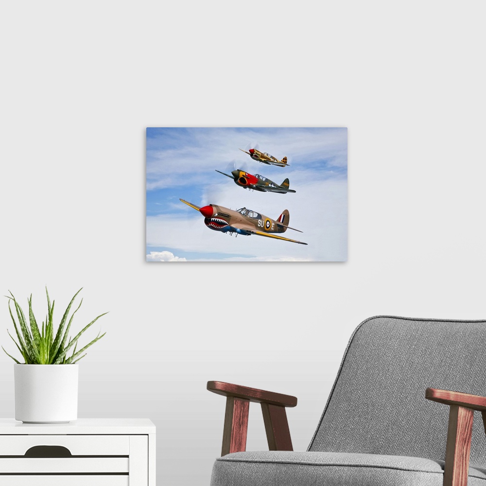 A modern room featuring A group of P-40 Warhawks fly in formation near Nampa, Idaho.
