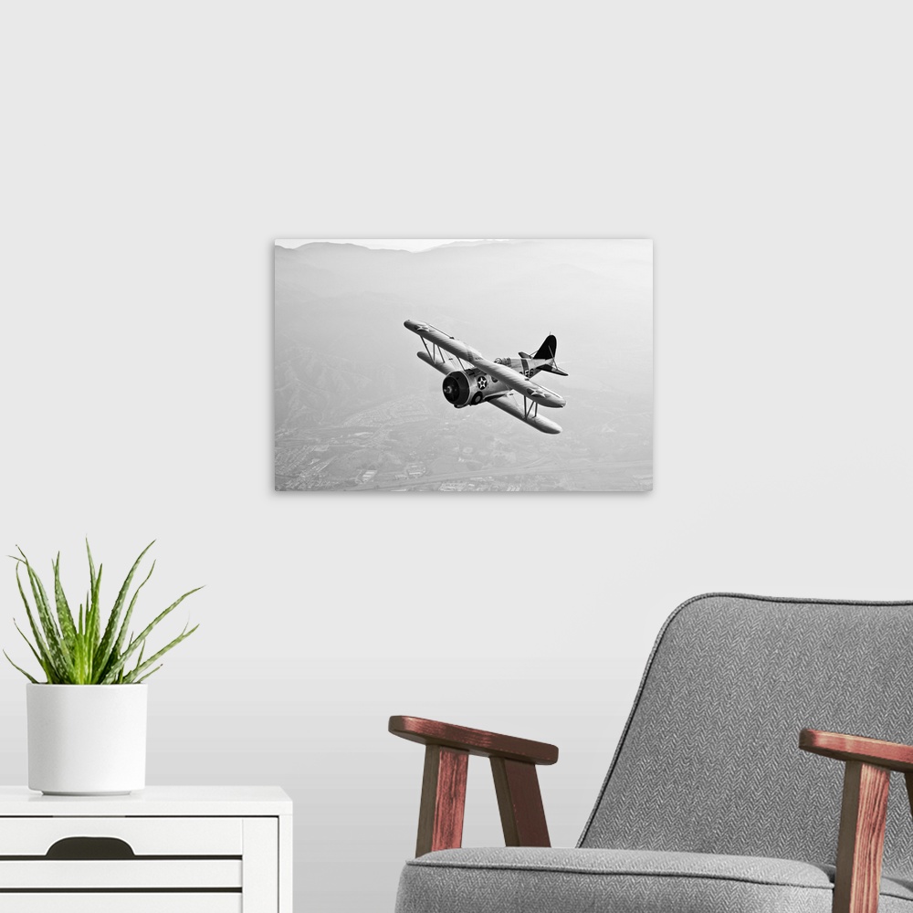 A modern room featuring A Grumman F3F biplane in flight.