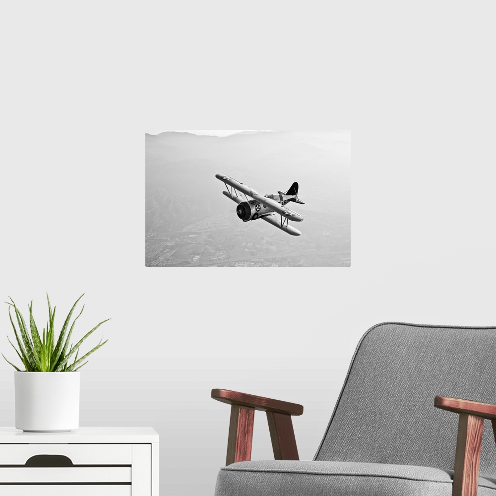A modern room featuring A Grumman F3F biplane in flight.