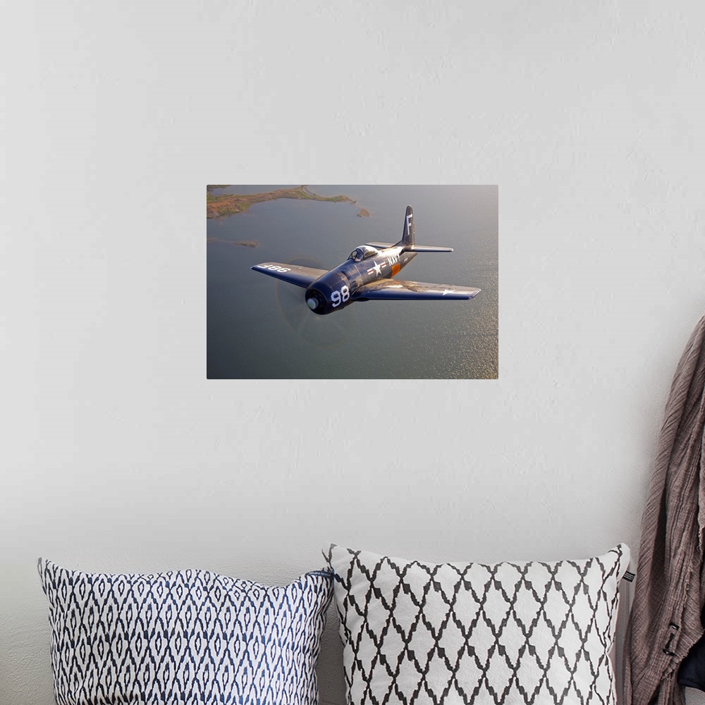 A bohemian room featuring A Grumman F8F Bearcat in flight near Chino, California.