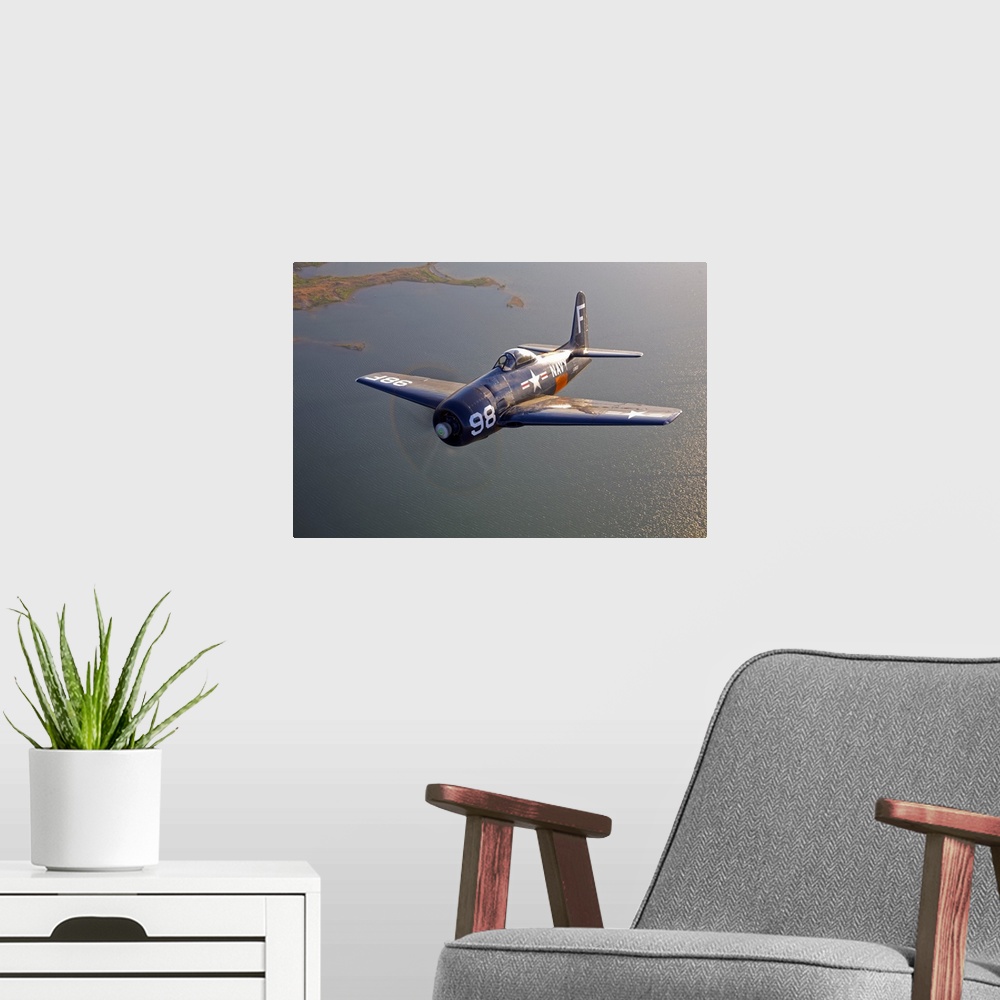 A modern room featuring A Grumman F8F Bearcat in flight near Chino, California.