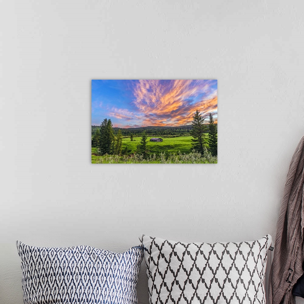 A bohemian room featuring July 9, 2014 - A high dynamic range photo of a sunset over a log cabin at Cypress Hills Interprov...