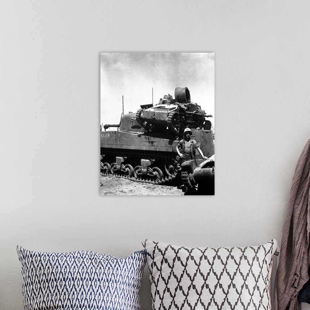 A bohemian room featuring A Japanese light tank sits atop the medium tank Killer, 1944.