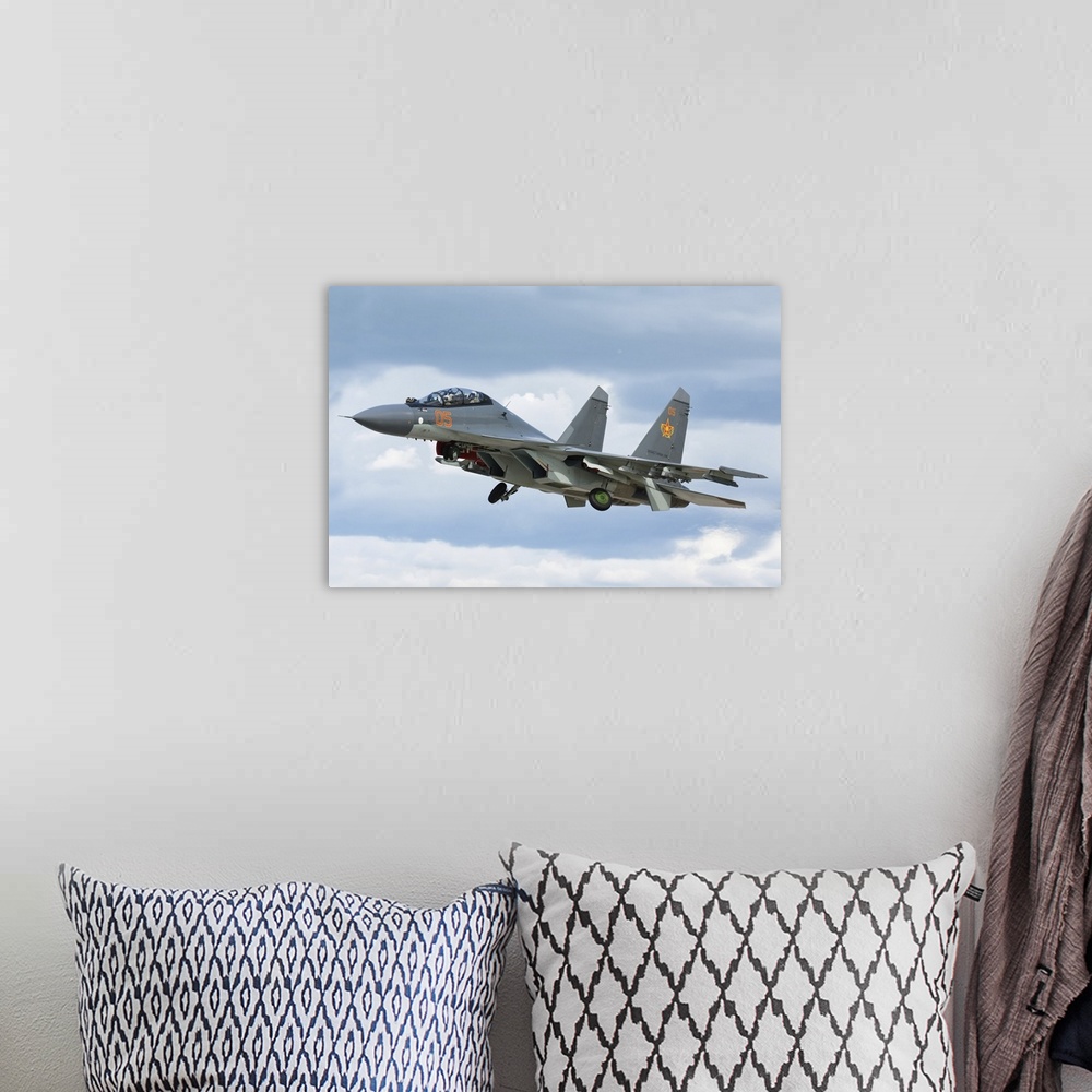 A bohemian room featuring A Kazakhstan Air Defense Forces Su-30SM fighter-bomber plane.