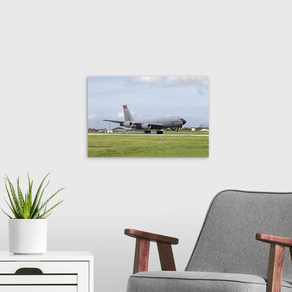 A modern room featuring A KC-135 Stratotanker from the 18th Wing at Kadena Air Base, Okinawa, Japan, touches down on the ...