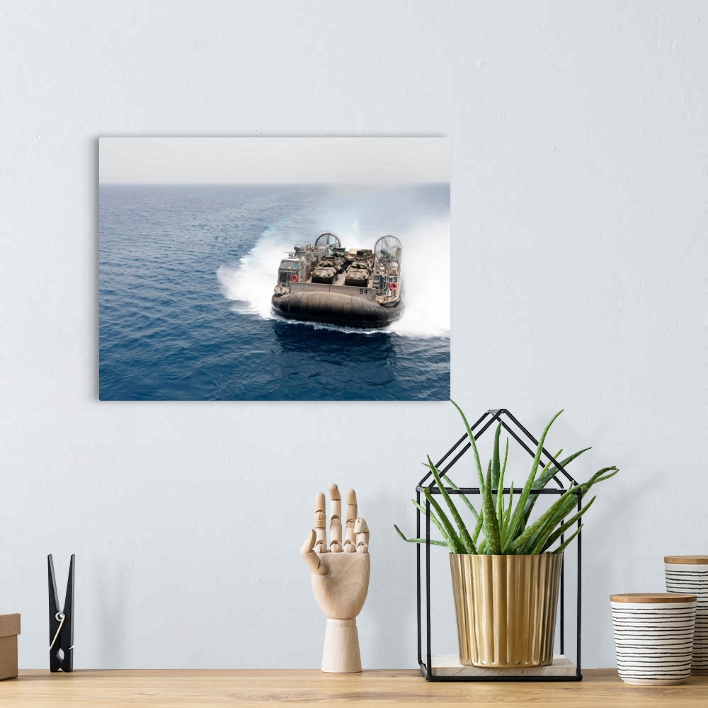 A bohemian room featuring A landing craft air cushion transits the Gulf of Aden.